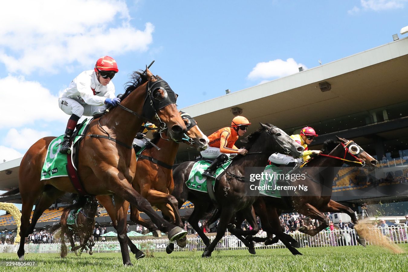 Jockeys and horses in a close finish during a race at Rosehill Gardens